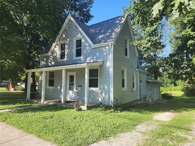 view of front of home featuring a front yard and covered porch