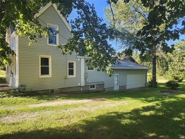 rear view of house with a yard