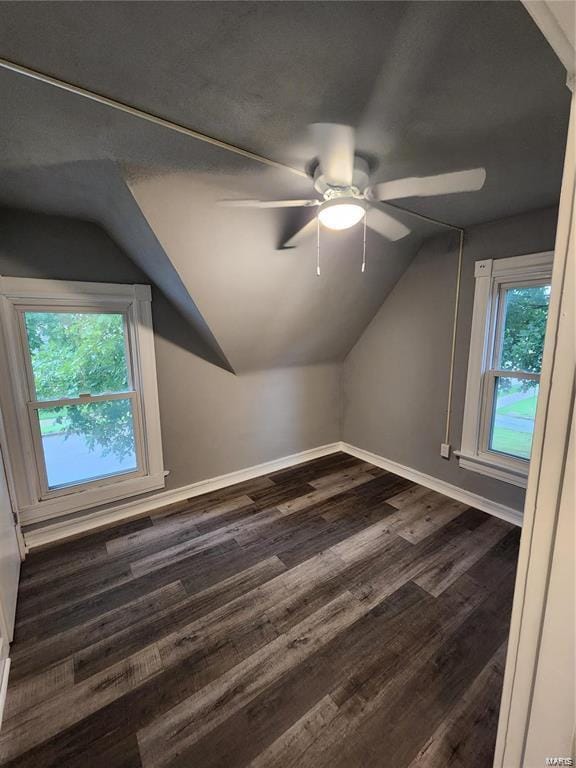 bonus room featuring lofted ceiling, ceiling fan, and dark hardwood / wood-style floors