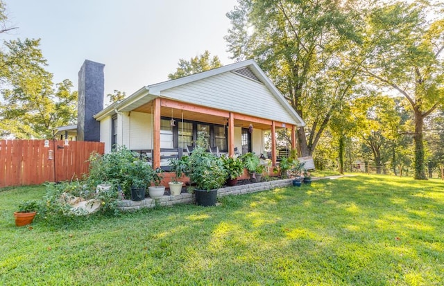 exterior space featuring a porch and a front lawn