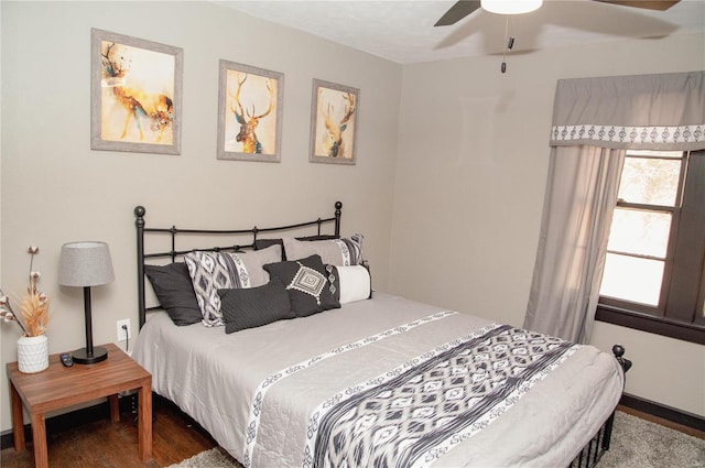 bedroom with hardwood / wood-style floors and ceiling fan