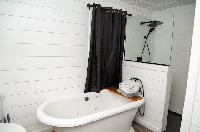 bathroom with hardwood / wood-style floors, wooden walls, and separate shower and tub