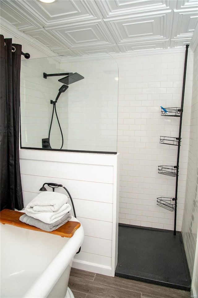 bathroom featuring hardwood / wood-style floors and a shower with shower curtain