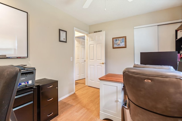 office featuring light hardwood / wood-style flooring and ceiling fan