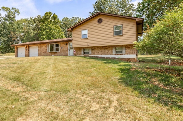 split level home featuring an attached garage and a front lawn