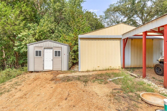 view of pole building with a storage shed