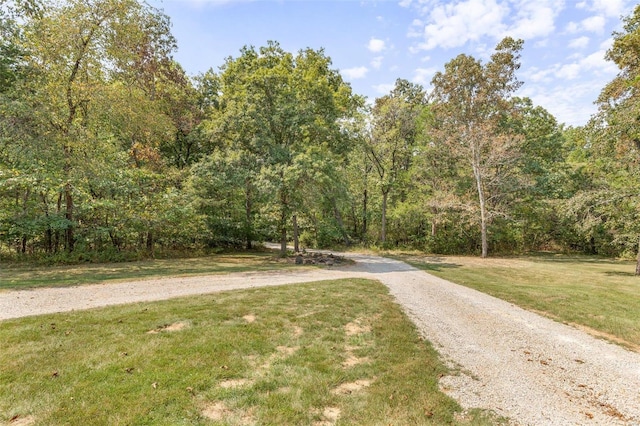 view of street featuring a forest view