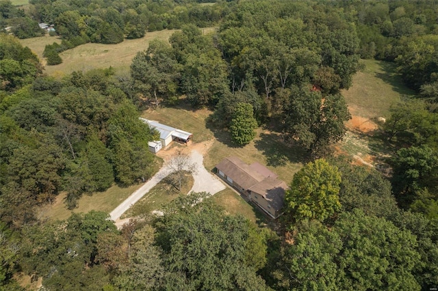 aerial view featuring a wooded view