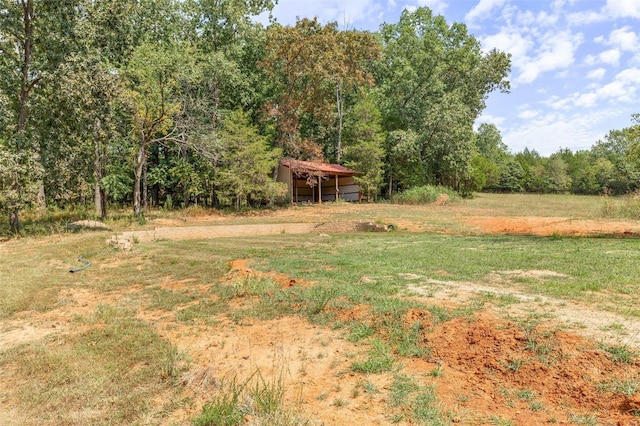 view of yard featuring an outbuilding and a pole building