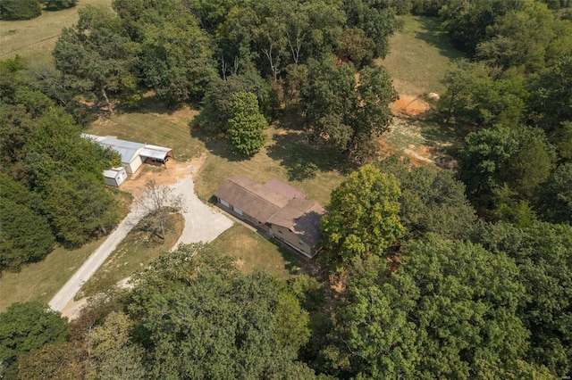 drone / aerial view featuring a view of trees