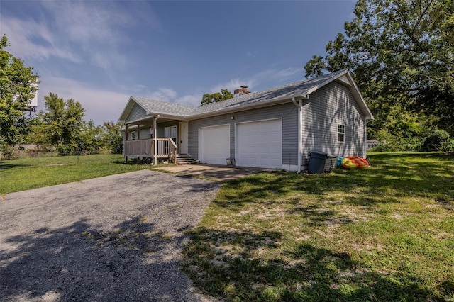 view of front facade with a garage and a front lawn