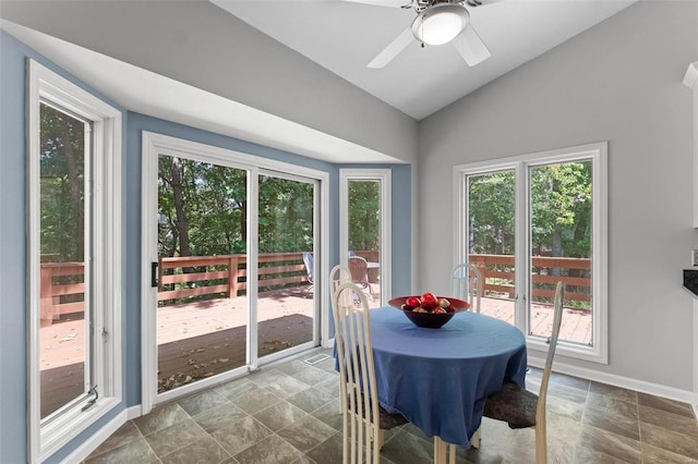 dining area with vaulted ceiling and ceiling fan