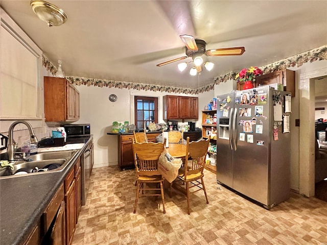 kitchen featuring ceiling fan, appliances with stainless steel finishes, and sink