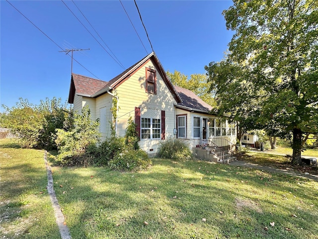 view of home's exterior with a yard