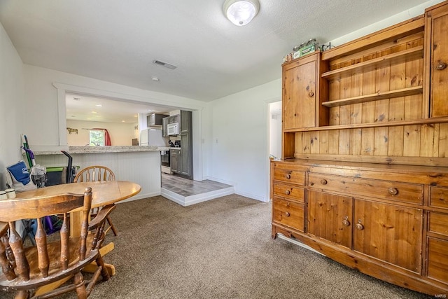 interior space with dark colored carpet