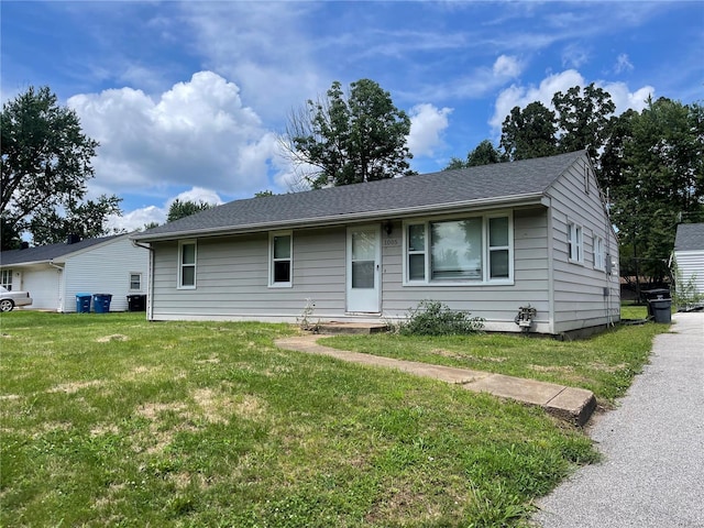 ranch-style home with a front lawn