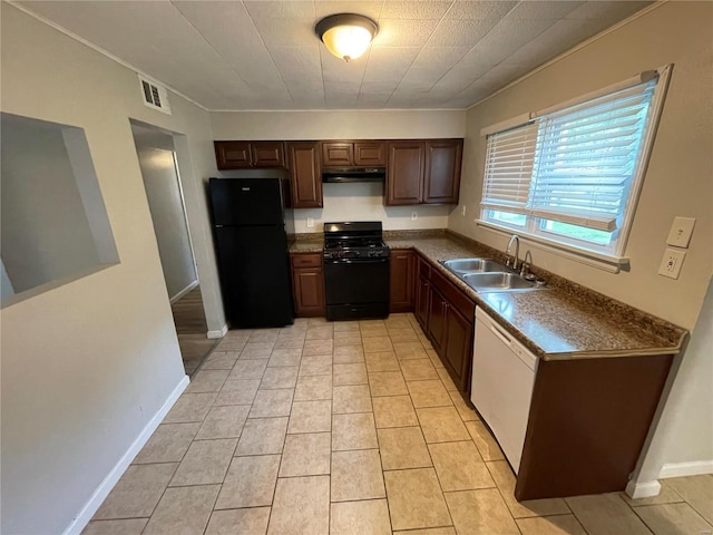 kitchen with crown molding, black appliances, sink, and light tile patterned flooring