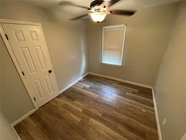 interior space with wood-type flooring and ceiling fan