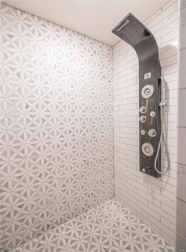 bathroom with tiled shower