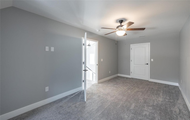 empty room with carpet floors and ceiling fan