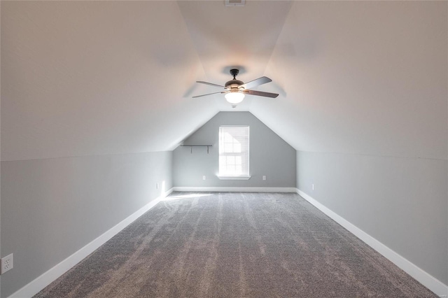 bonus room featuring lofted ceiling, carpet floors, and ceiling fan