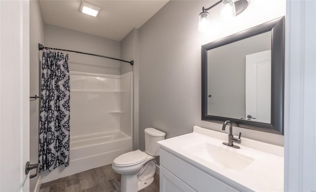 full bathroom featuring hardwood / wood-style flooring, vanity, shower / tub combo with curtain, and toilet