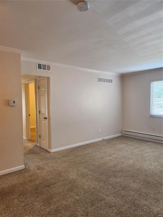 carpeted spare room with a baseboard heating unit, crown molding, and a textured ceiling