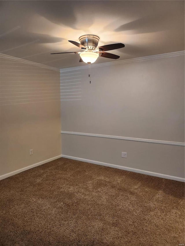 spare room featuring carpet flooring, ceiling fan, and crown molding