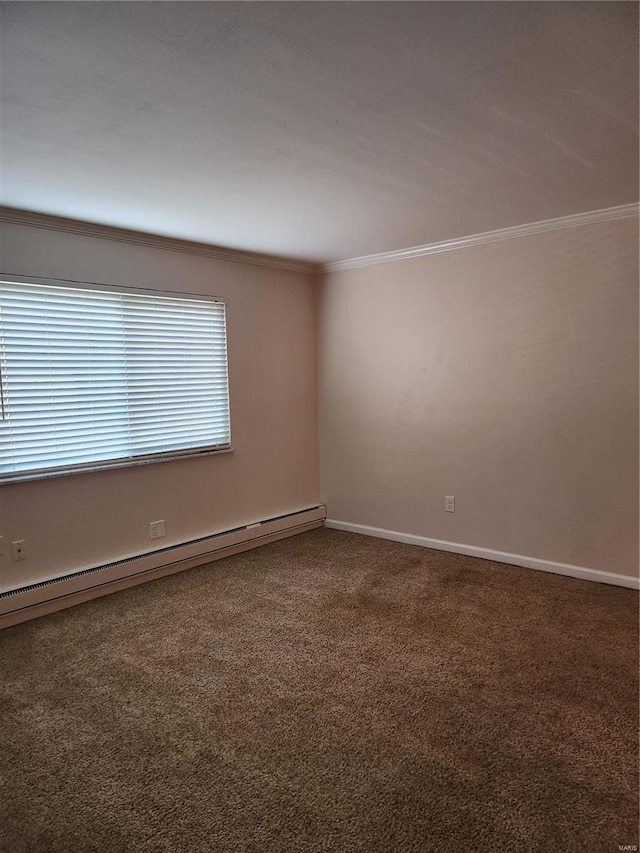 spare room with crown molding, carpet flooring, and a baseboard radiator