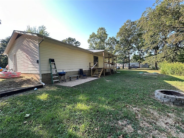 view of yard with a patio area and a fire pit