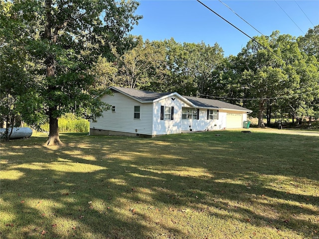 exterior space with a front lawn and a garage