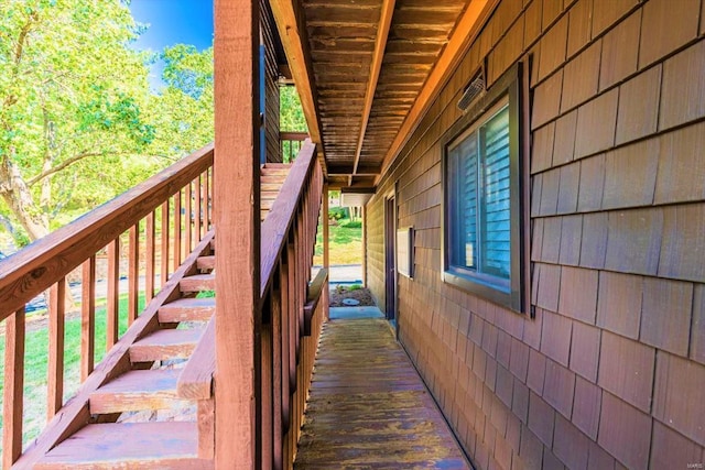 view of property exterior with a deck