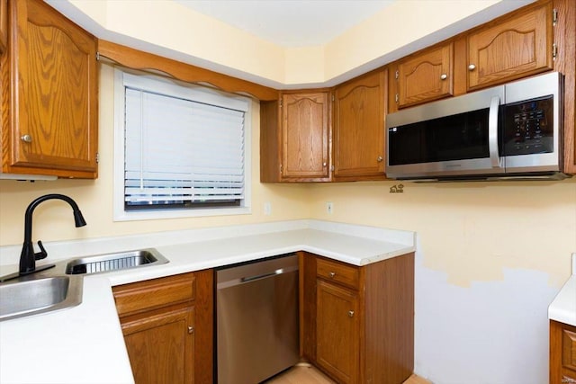 kitchen featuring stainless steel appliances and sink