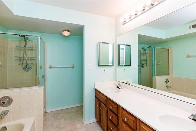 bathroom with tile patterned flooring, vanity, and independent shower and bath