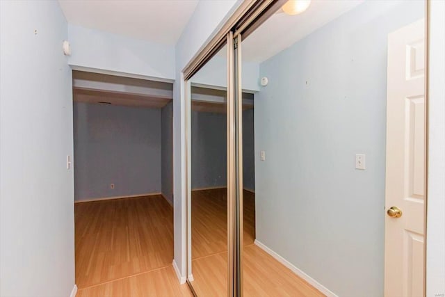 hallway featuring light hardwood / wood-style flooring