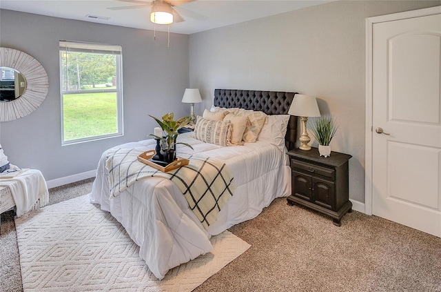 carpeted bedroom with ceiling fan