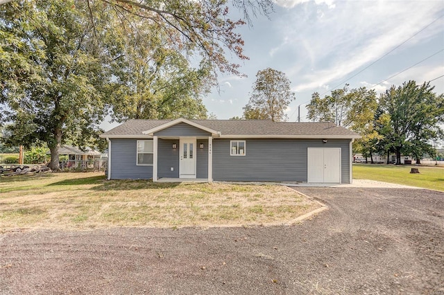 ranch-style home with a front lawn