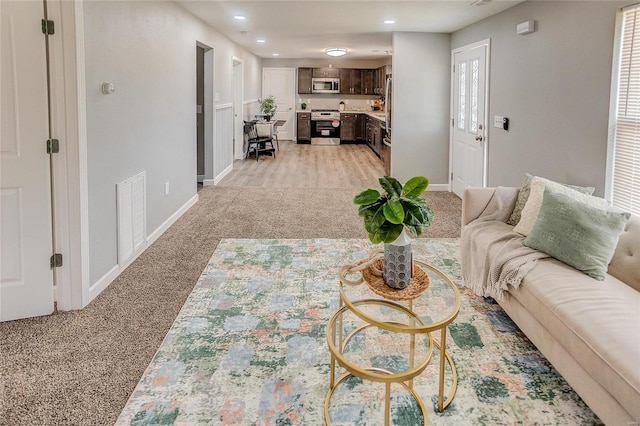 living room with light colored carpet