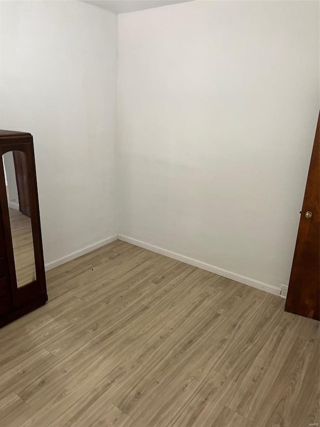 spare room featuring light wood-type flooring