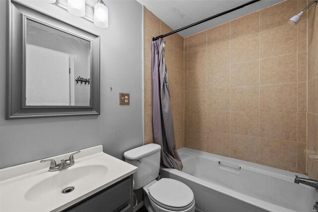 full bathroom featuring vanity, toilet, and shower / bath combination with curtain