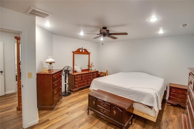 bedroom with hardwood / wood-style floors and ceiling fan