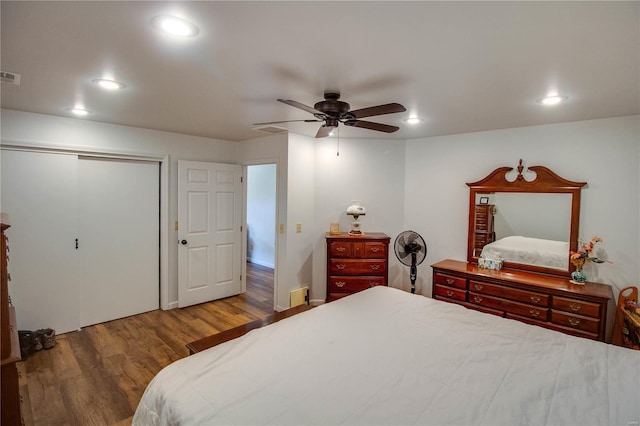 bedroom featuring a closet, ceiling fan, and hardwood / wood-style floors