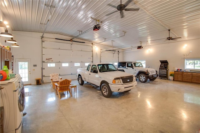 garage with ceiling fan, a garage door opener, and washer / dryer