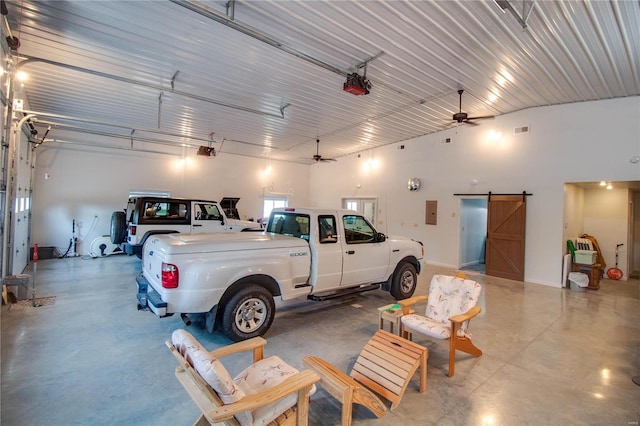 garage featuring ceiling fan and a garage door opener