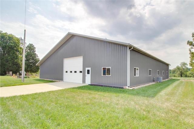 exterior space featuring a yard and central air condition unit