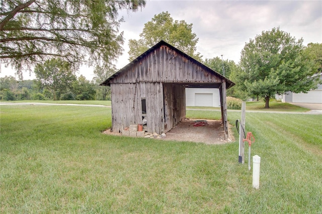 view of outbuilding with a lawn