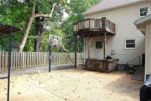 view of basketball court with fence