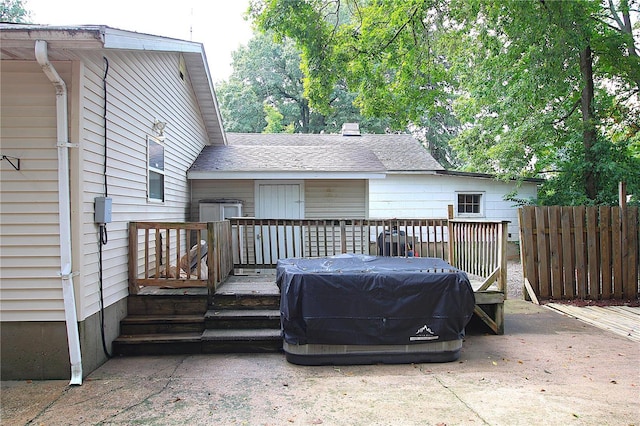 deck with a grill and fence