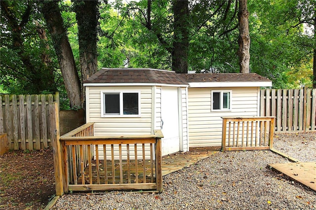 view of shed featuring fence