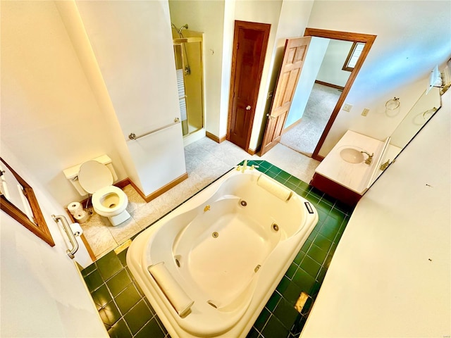 bathroom featuring a tub with jets, a shower stall, and baseboards